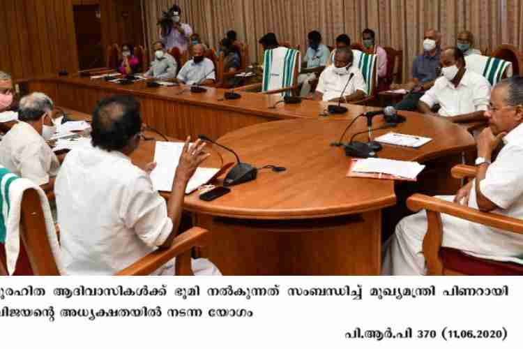 Chief Minister Pinarayi Vijayan at a meeting on land allotment to landless Adivasis