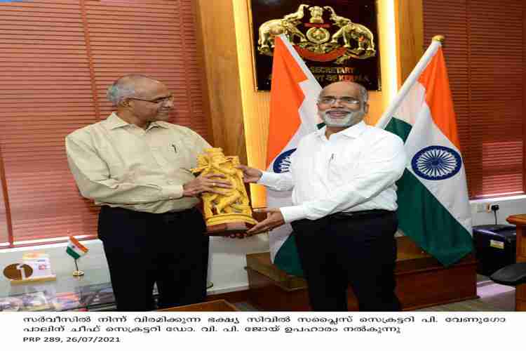 Chief Secretary VP Joy presents memento to retiring Food & Civil Supplies secretary